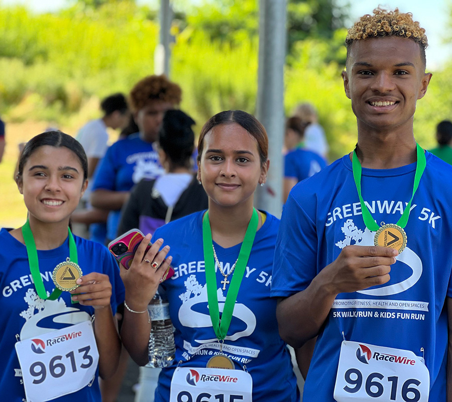 Greenway 5k runners with medals