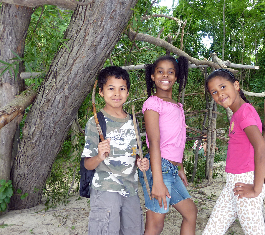 Urban Adventures children outside under tree